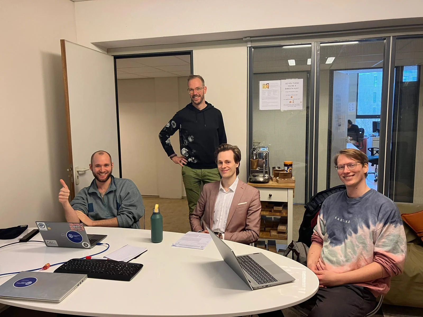 Lab members around a meeting table